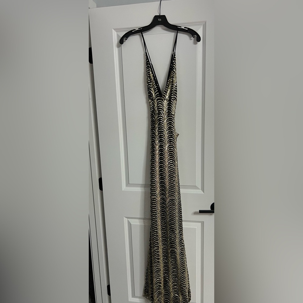 Beautiful NWOT black and gold sexy, formal dress, never worn.
